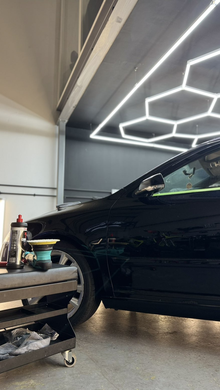 Protected paint surface reflecting studio lighting